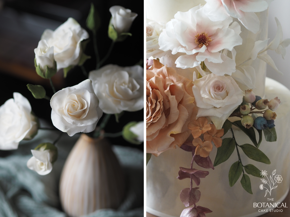 Gumpaste white majolica spray rose sugar flowers in a ceramic vase, a sugar flowers arrangement on a wedding cake with butterfly ranunculus, toffee rose, blueberries, spray rose, hydrangea, bleached ruscus, italian ruscus, red eucalyptus