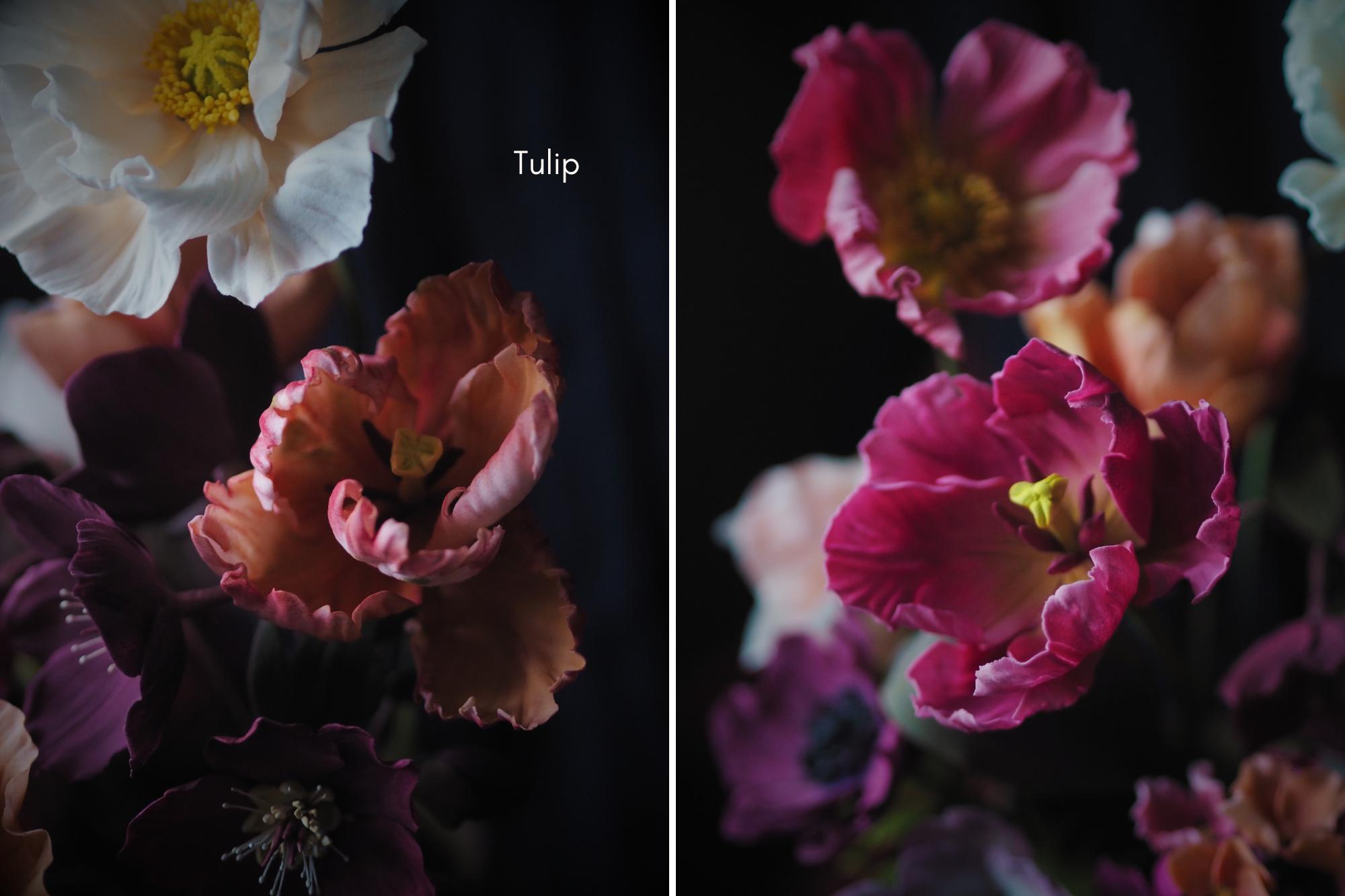 Tulip sugar flowers in jewel tones pinks and peach against a dark background