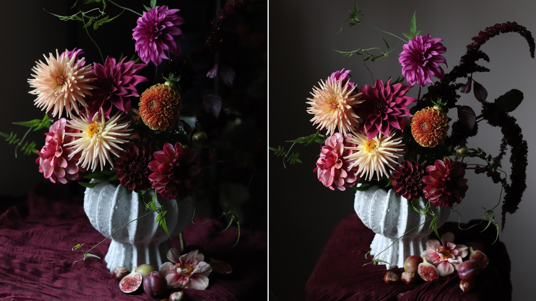 An arrangement of dahlias in Autumnal colours in a white vase against a dark background